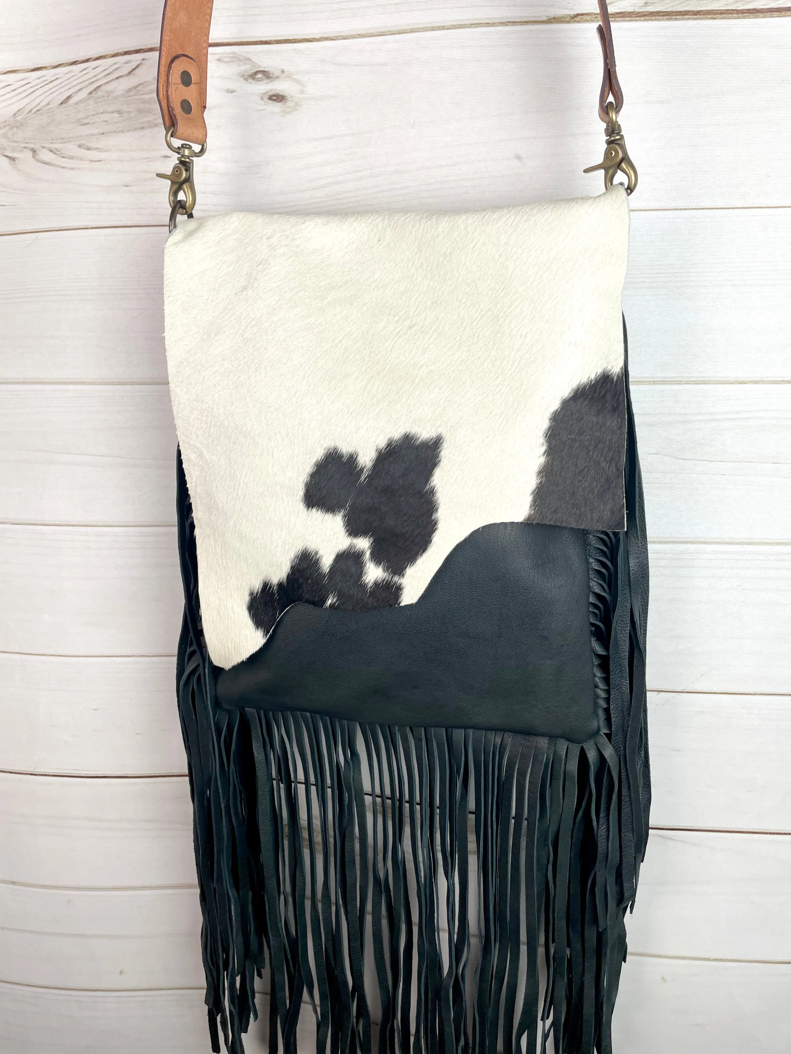Black and White Raw Hide Flap on Black Leather with Fringe Crossbody Bag