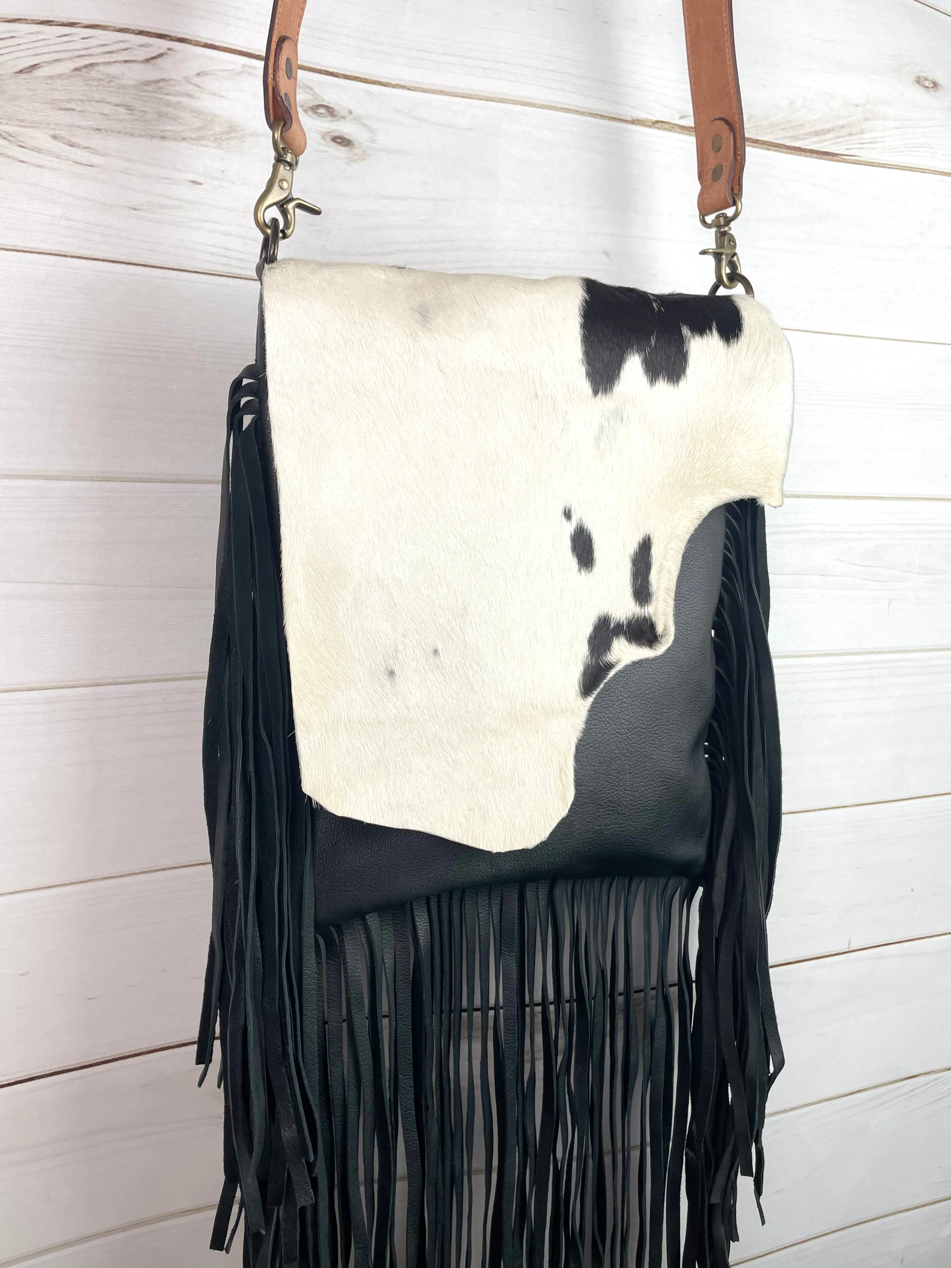 Black and White Raw Hide Flap on Black Leather with Fringe Crossbody Bag