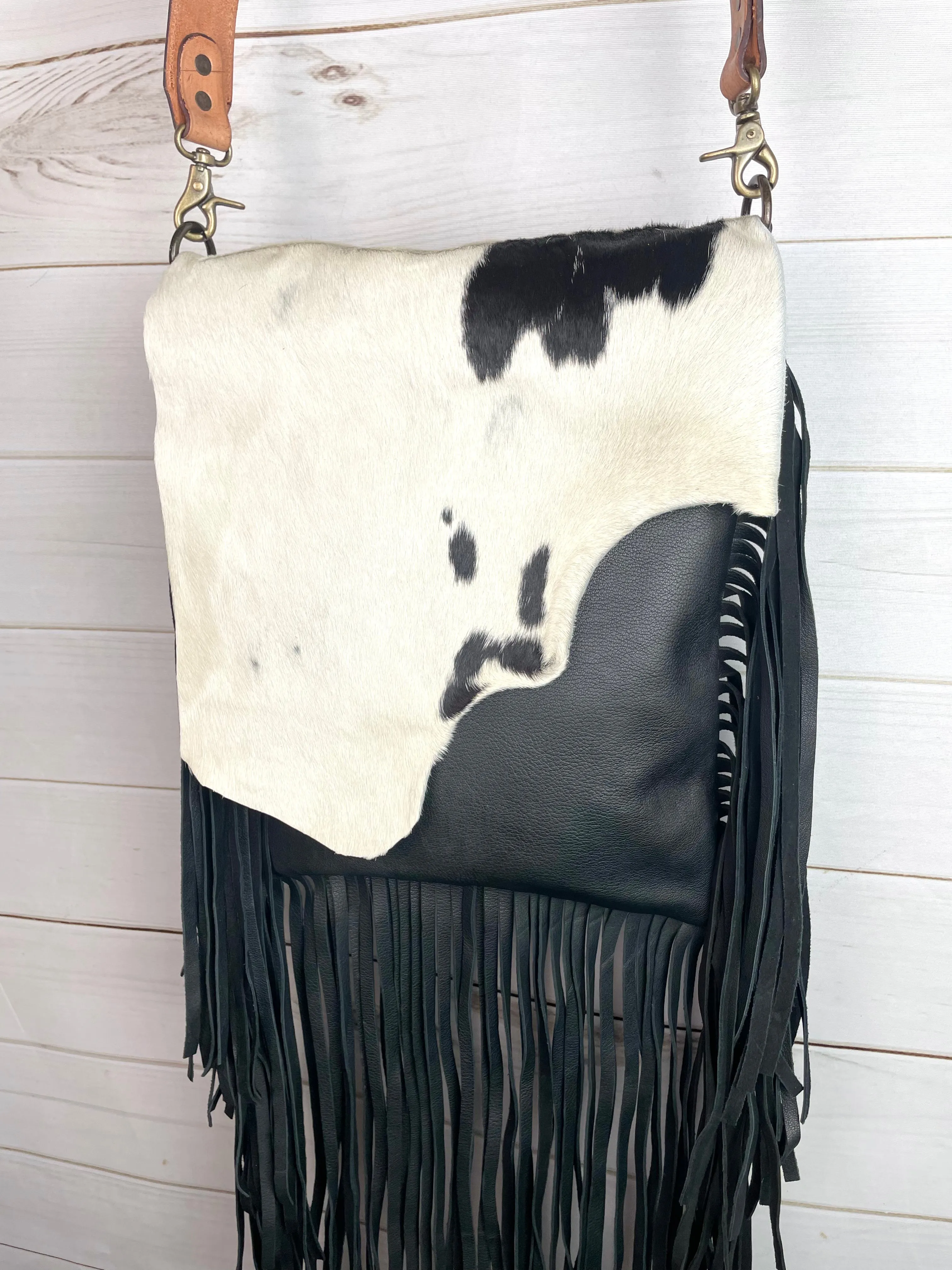 Black and White Raw Hide Flap on Black Leather with Fringe Crossbody Bag