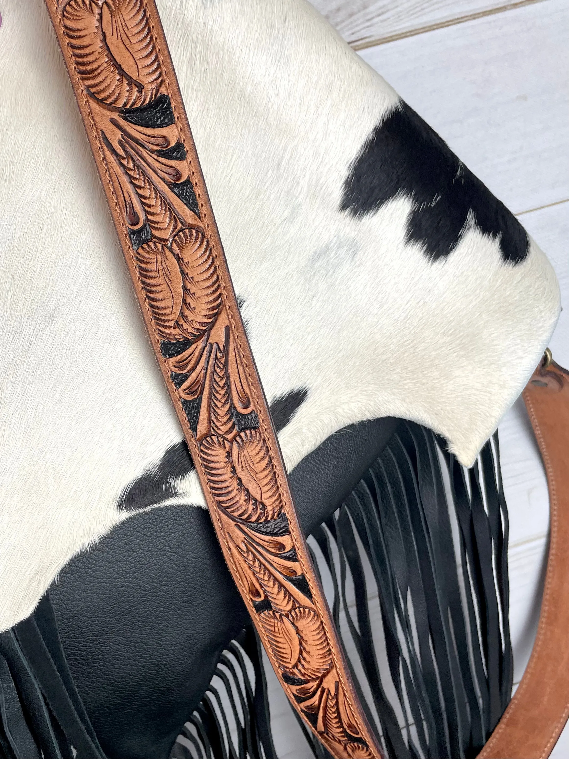 Black and White Raw Hide Flap on Black Leather with Fringe Crossbody Bag