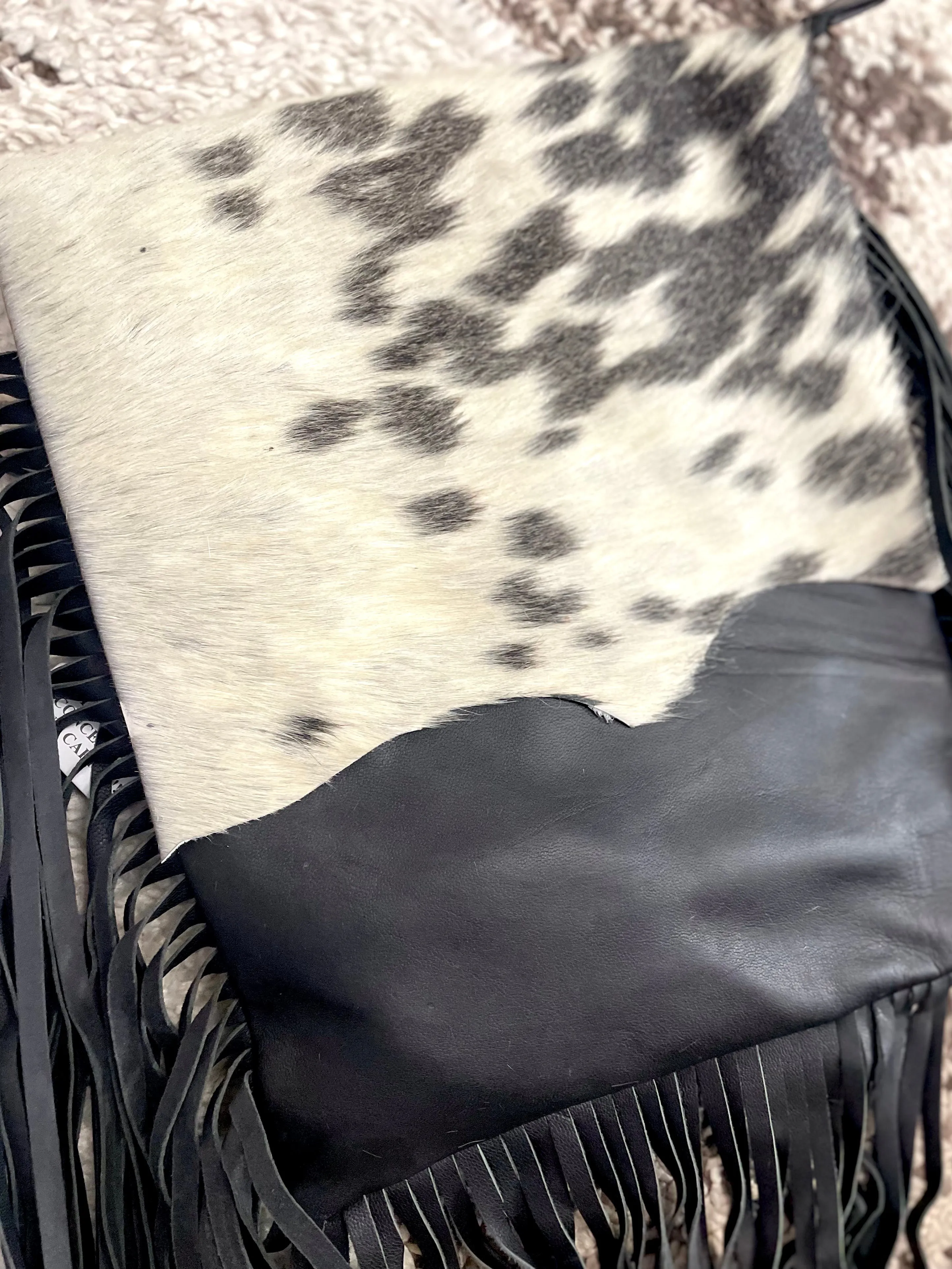 Black and White Raw Hide Flap on Black Leather with Fringe Crossbody Bag