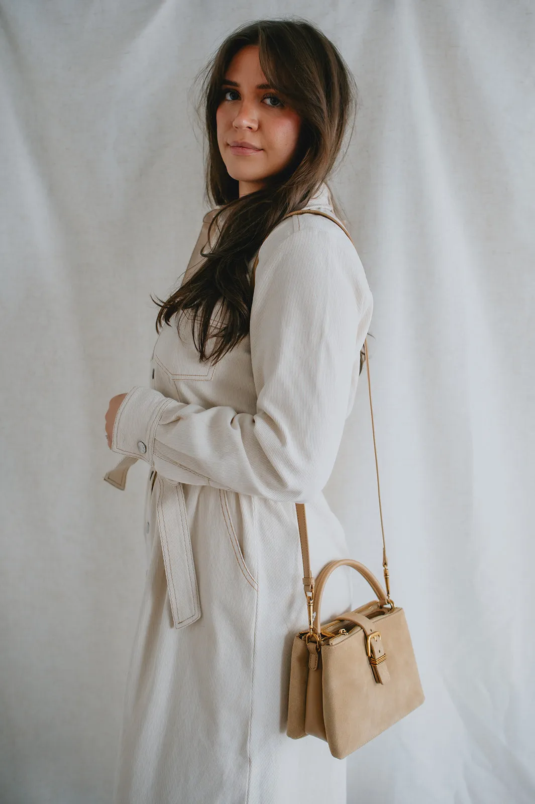 The Charly Mini Buckle Bag by Dolce Vita - Tan Suede